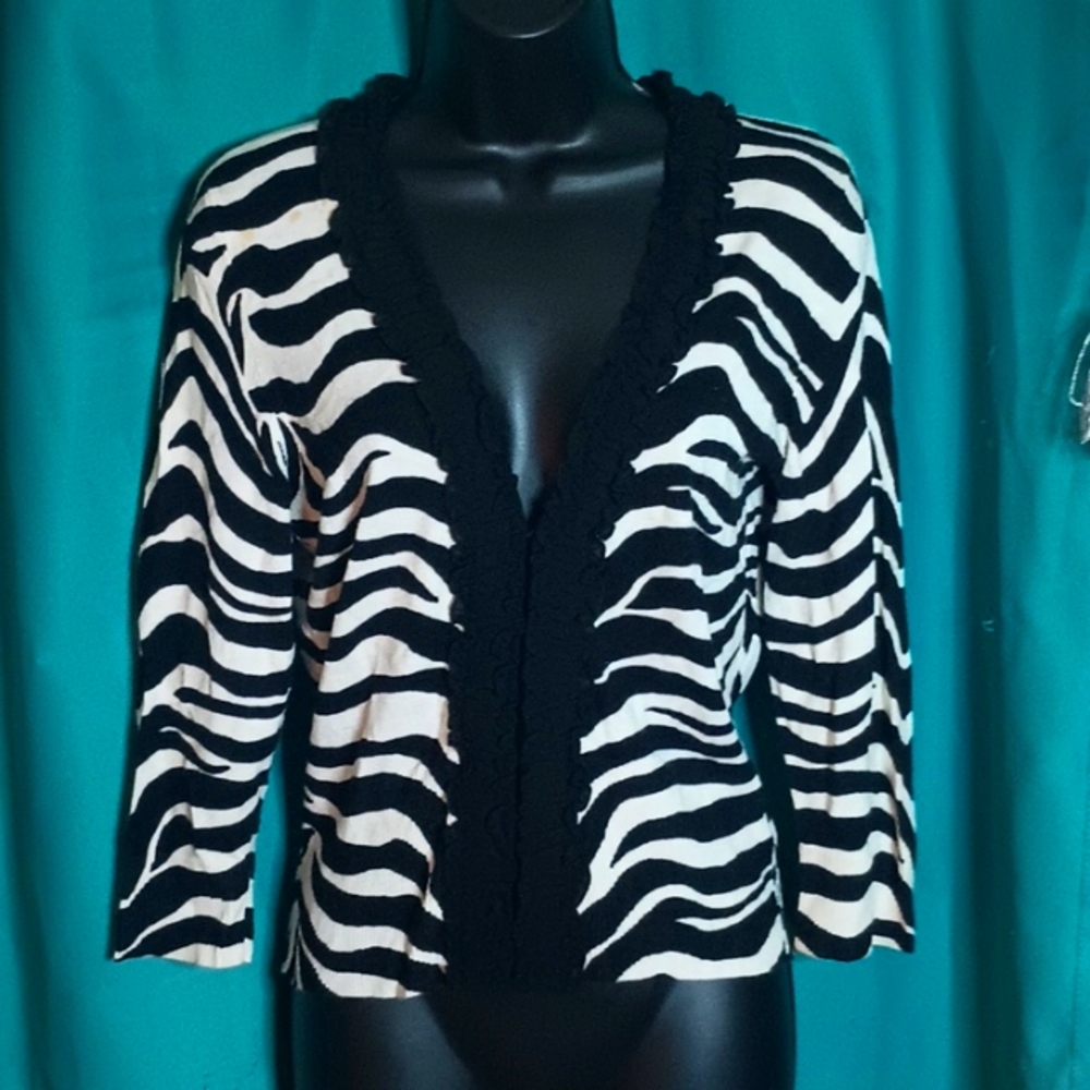 Women's zebra print sweater, with little hook enclosures down the front.